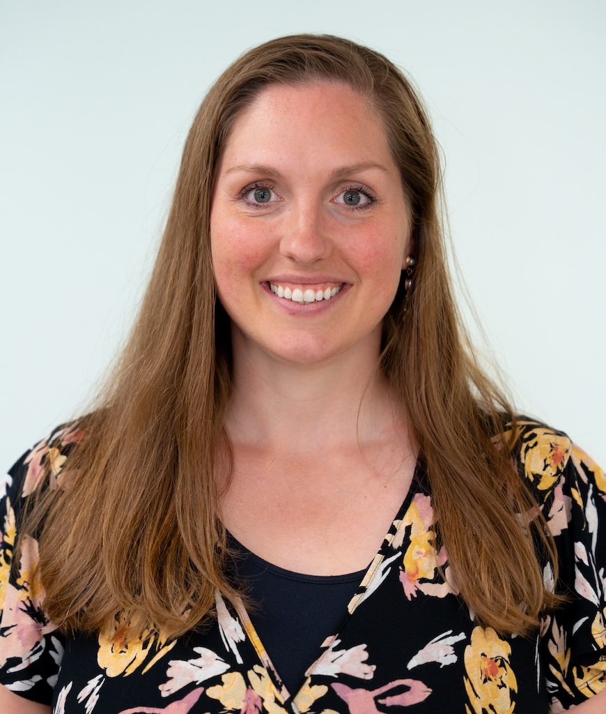 Doctor Lauren Mixtacki. A brown haired woman wearing a floral dress